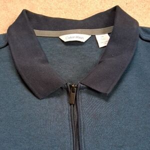 Calvin Klein Men's Dark Blue Zip-Up Polo Shirt.